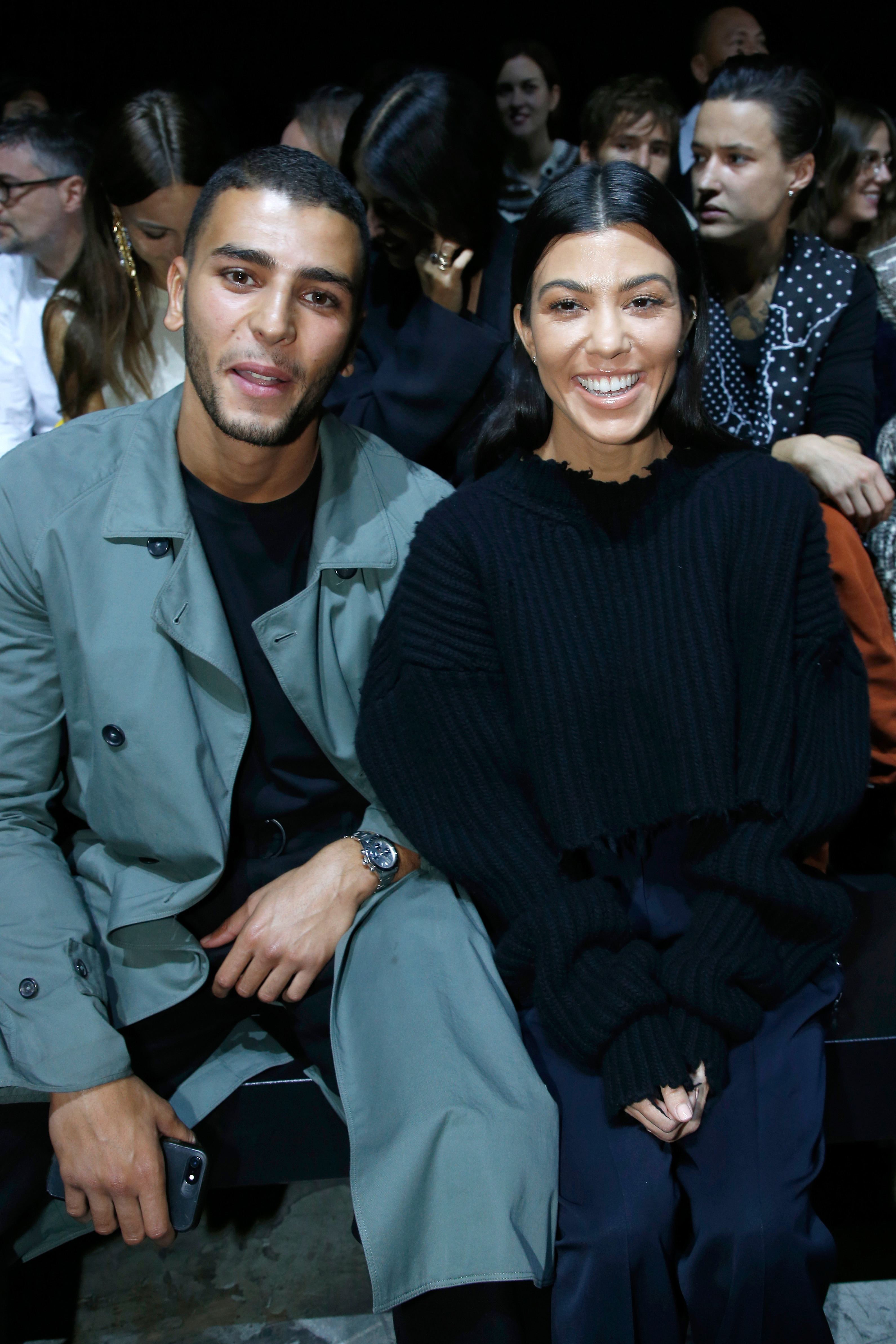 Kourtney Kardashian (L) and her companion Younes Bendjima attend Paris Fashion Week