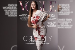 Gigi Hadid poses on cover of Vogue