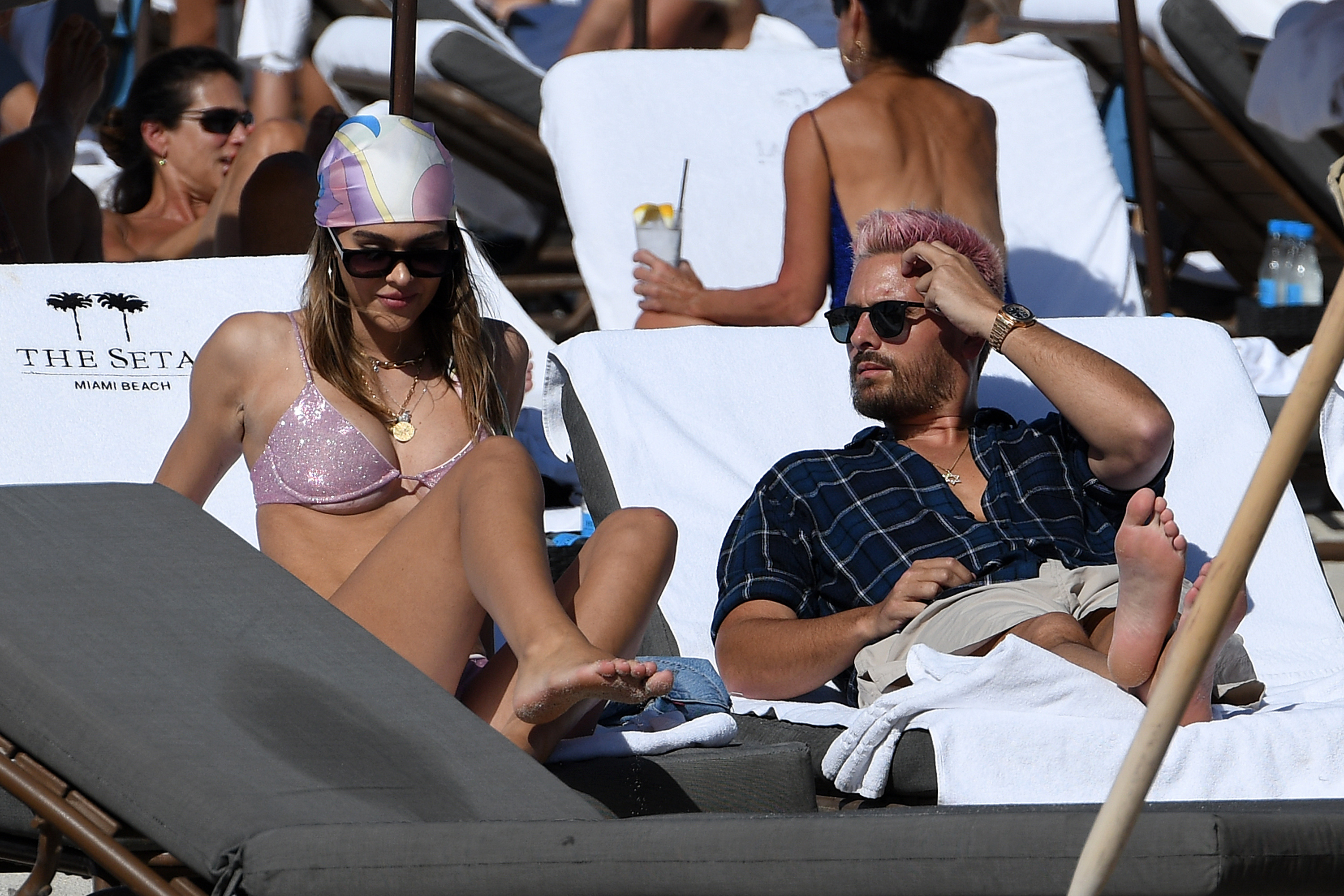 Amelia Hamlin and Scott Disick chat a they enjoy a beautiful sunny day.