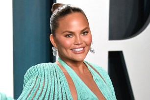 Chrissy Teigen poses at the 2020 Vanity Fair Oscar Party.