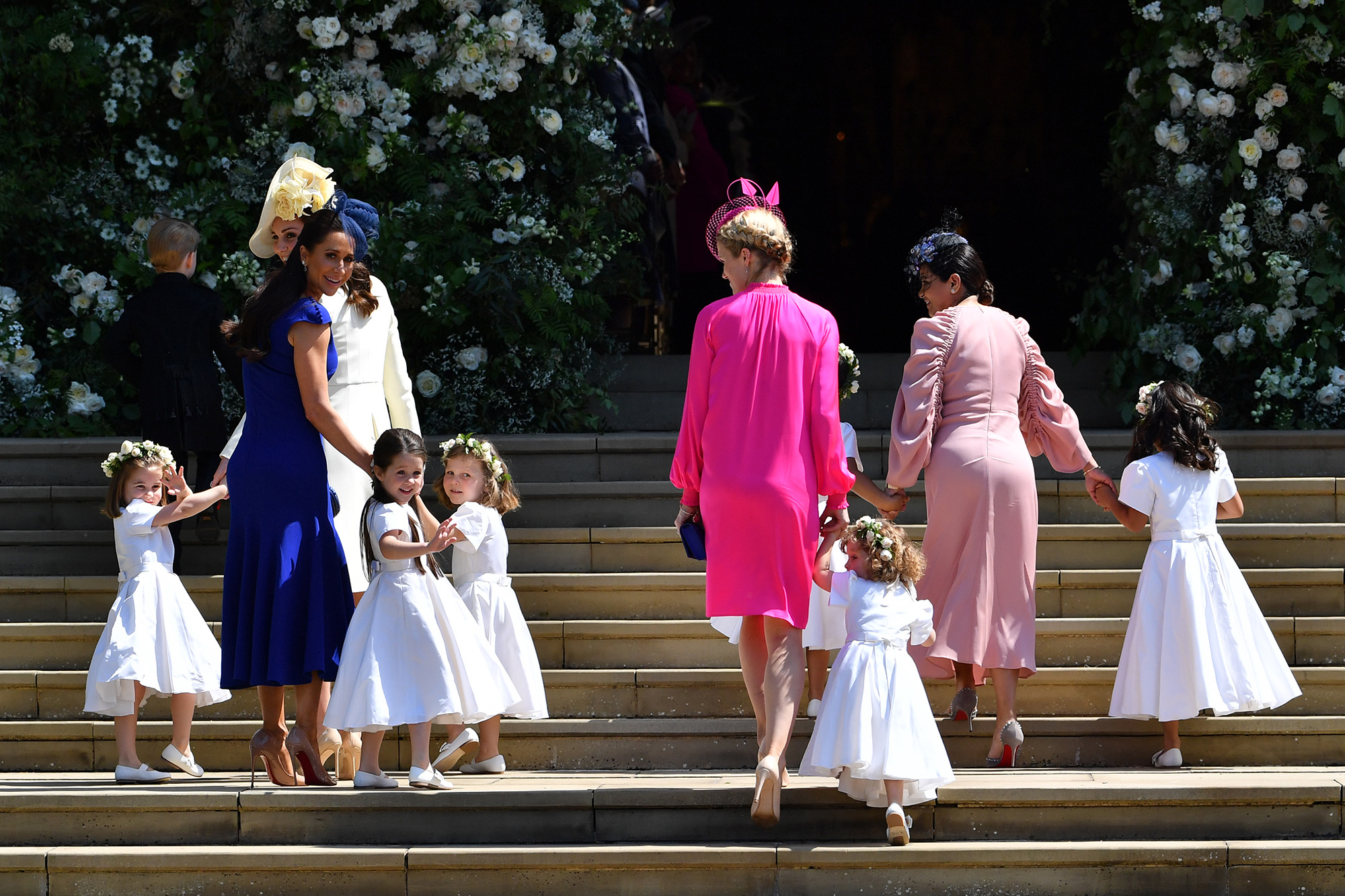 Princess Charlotte, Kate Middleton, Jessica Mulroney, Ivy Mulroney, Florence van Cutsem, Zoe Warren, Zalie Warren, Benita Litt, Remy Litt and Rylan Litt arrive for the wedding ceremony of Prince Harry and Meghan Markle at St George's Chapel, Windsor Castle on May 19, 2018.