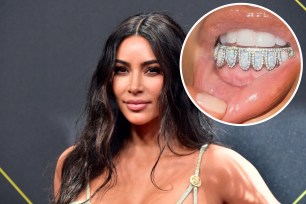 Kim Kardashian shows off her new opal and diamond "birthstone grill."