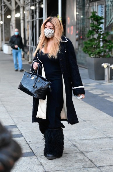 Wendy Williams accessorizes her black Hermès Birkin bag with a Louis Vuitton face mask as she steps out in New York City.