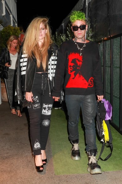 Avril Lavigne and boyfriend Mod Sun — still rocking a "Hot Topic Muppet" joint aesthetic — are spotted leaving their romantic dinner at Giorgio Baldi in Santa Monica, California.