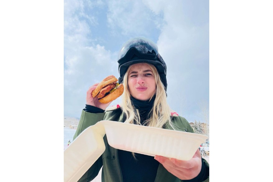 New mom Emma Roberts takes a break from skiing to bite down on a fried-chicken sandwich.