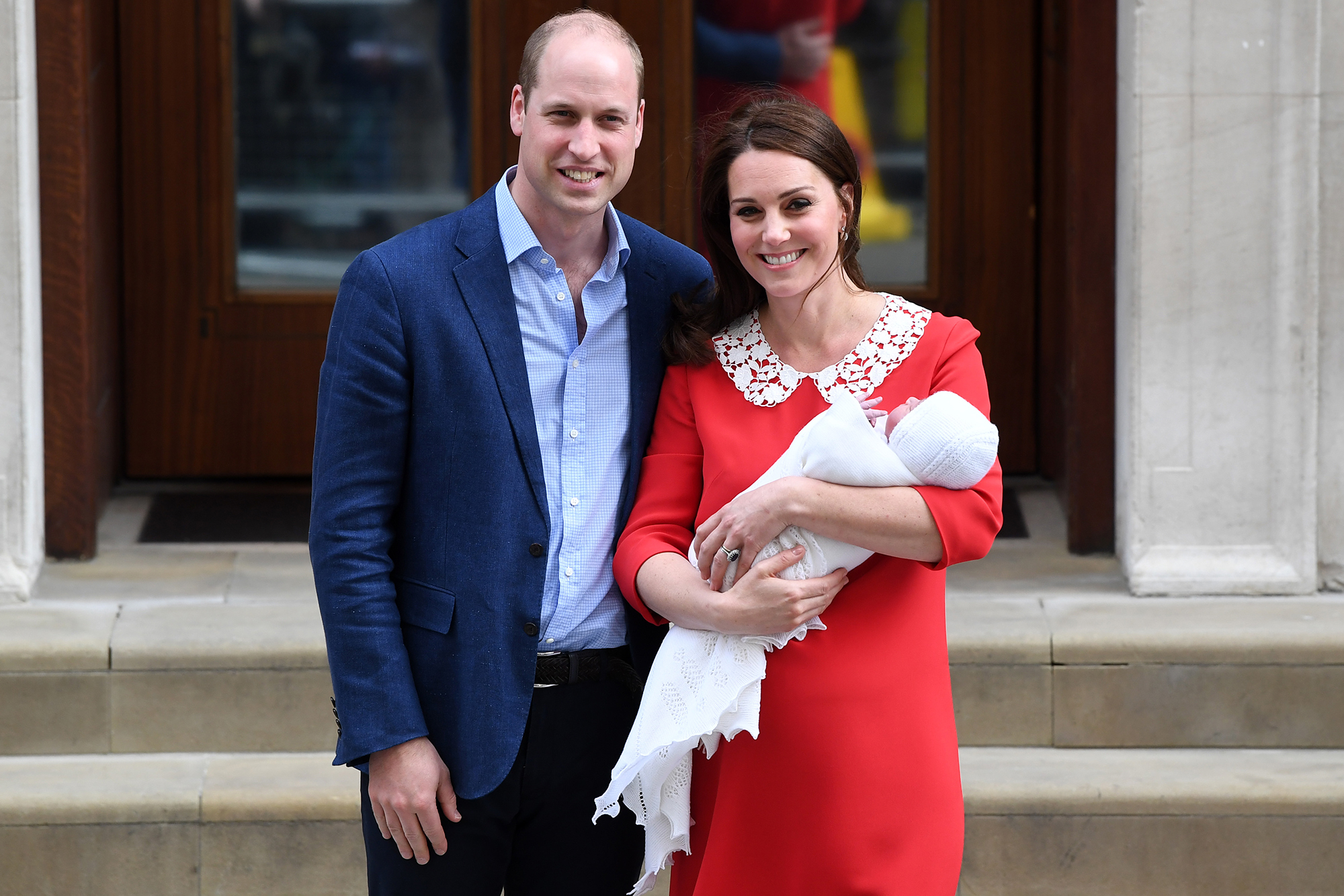 Prince William and Kate Middleton smile with son Prince Louis.