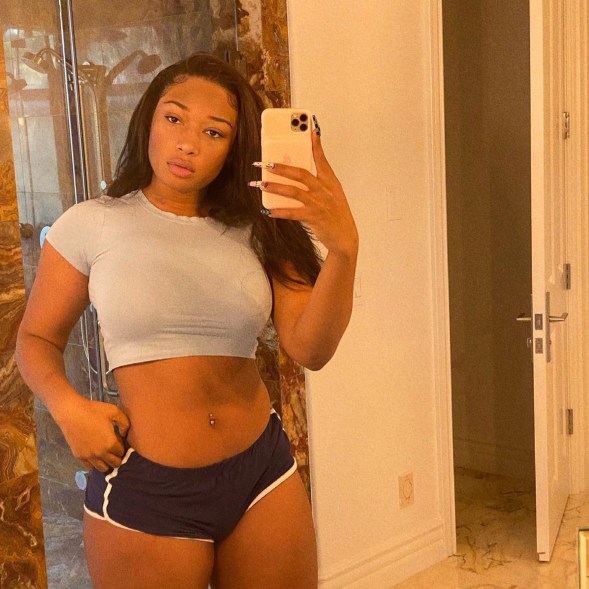 Megan Thee Stallion dons short shorts and a crop top for a selfie.