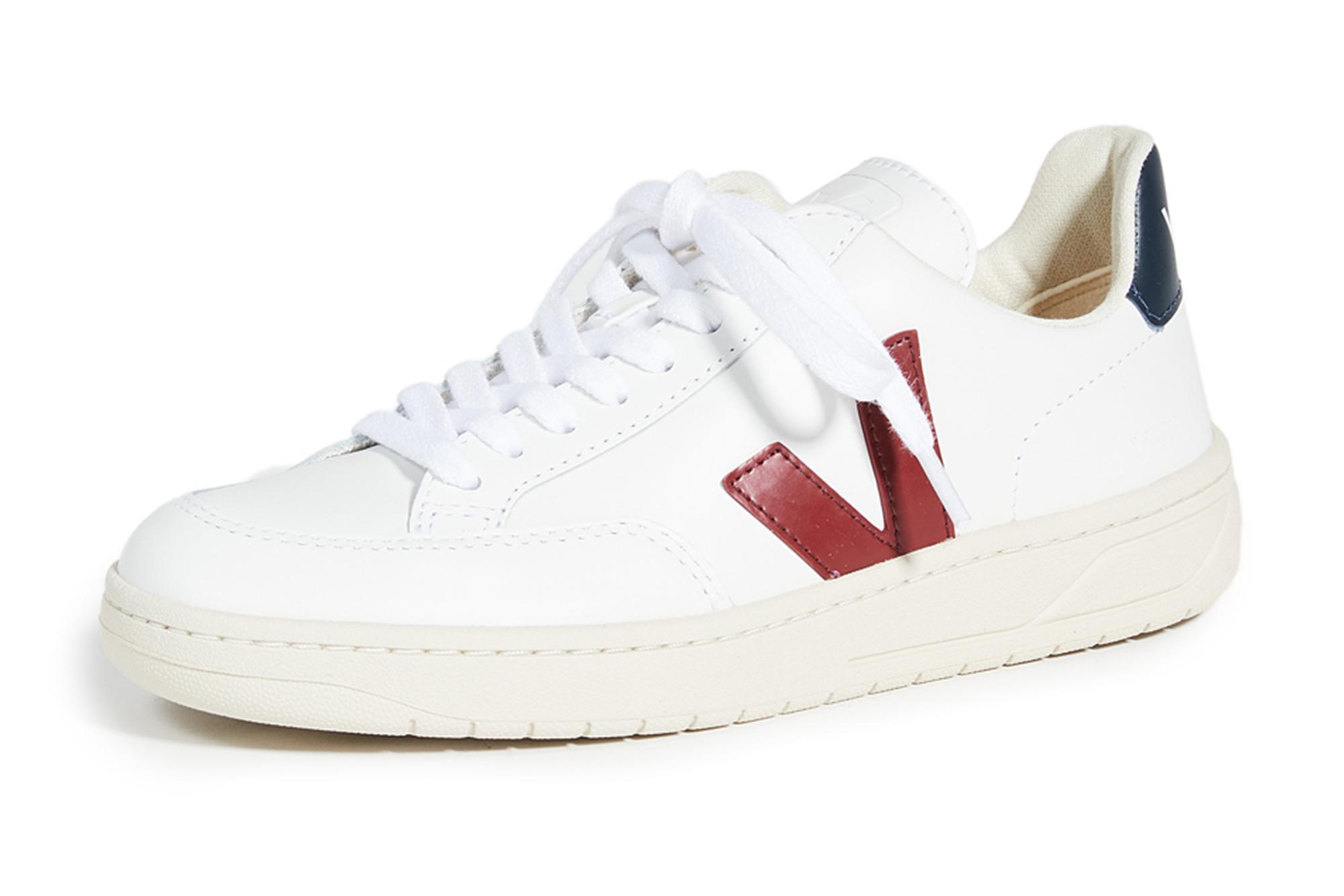 A Veja sneaker with red and blue accents