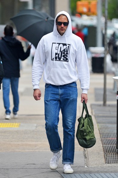 Alexander Skarsgard wears a hoodie and glasses while out in New York.