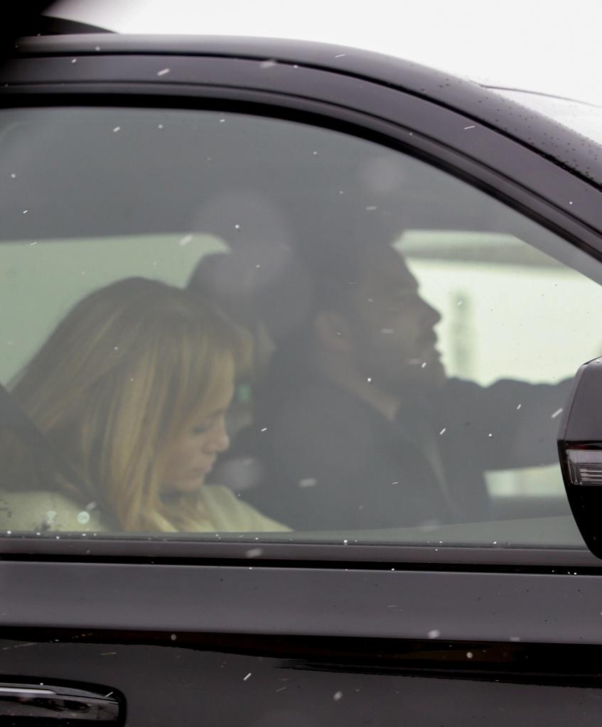 Ben Affleck driving Jennifer Lopez to the airport.