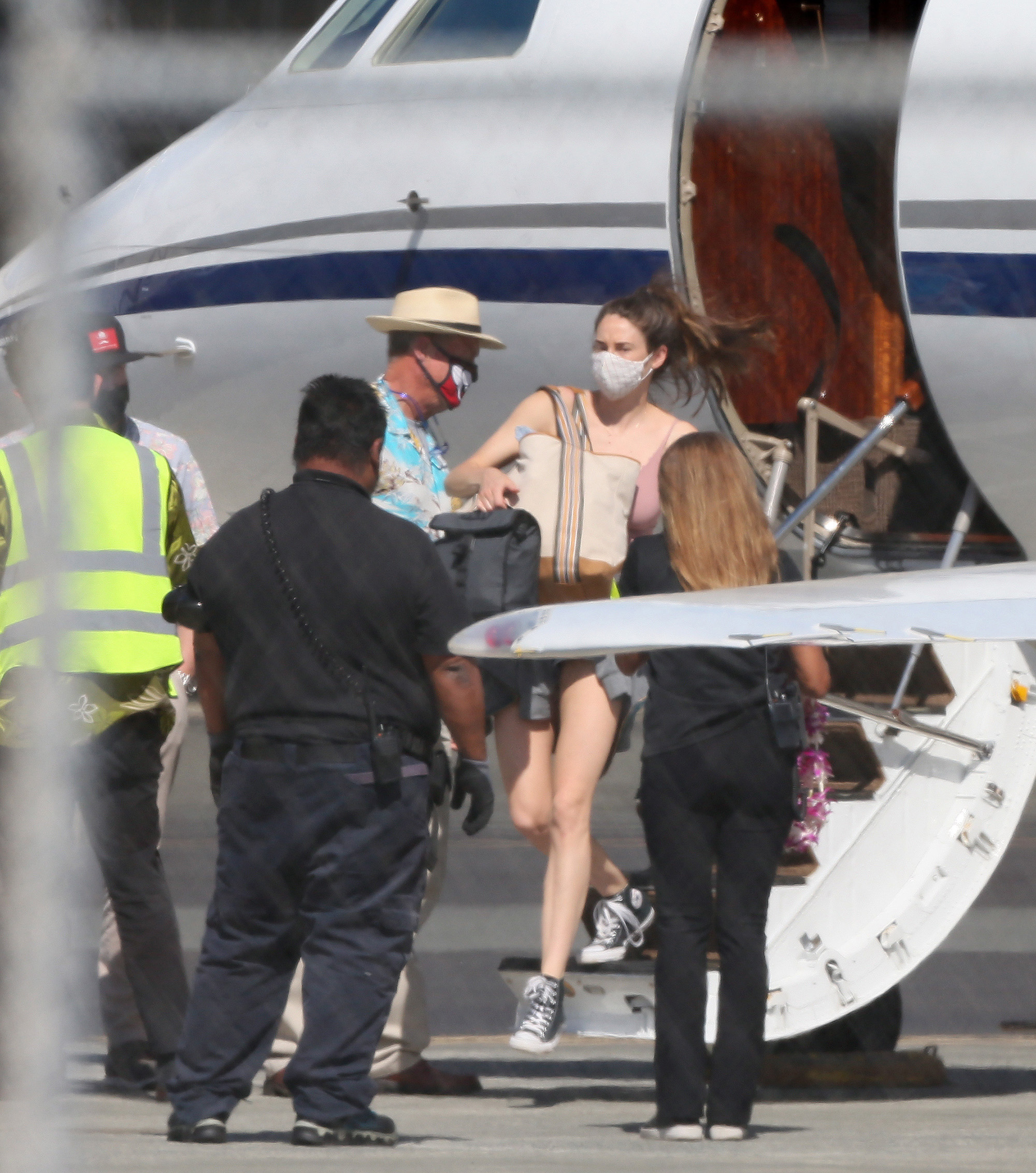 Shailene Woodley and Green Bay Packers quarterback Aaron Rodgers arrive in Hawaii.