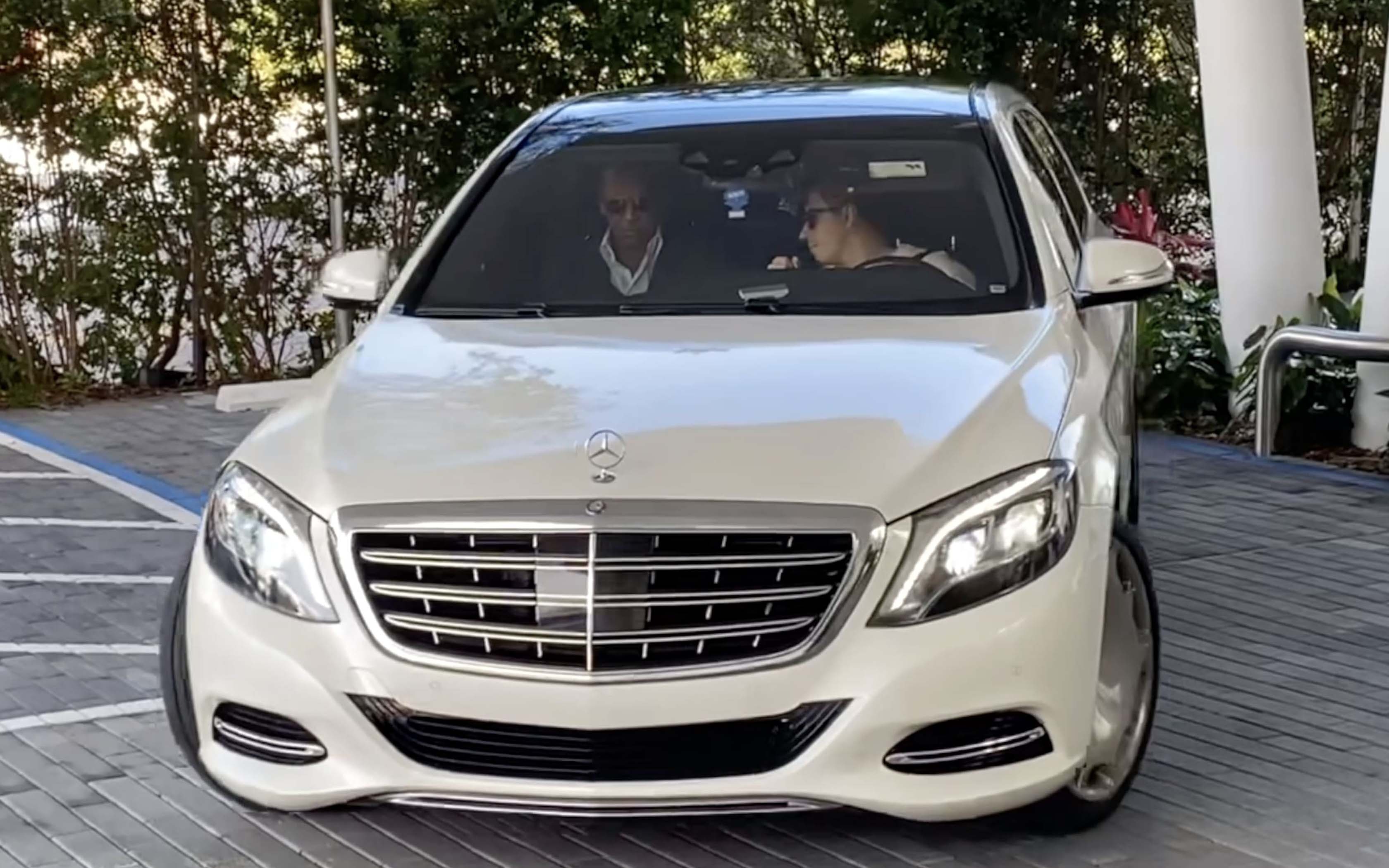Alex Rodriguez and his assistant in a car