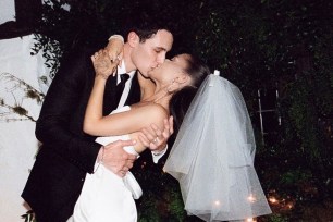 Ariana Grande kisses Dalton Gomez on their wedding day.