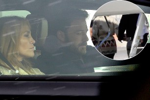 Ben Affleck driving with Jennifer Lopez in the passenger seat.