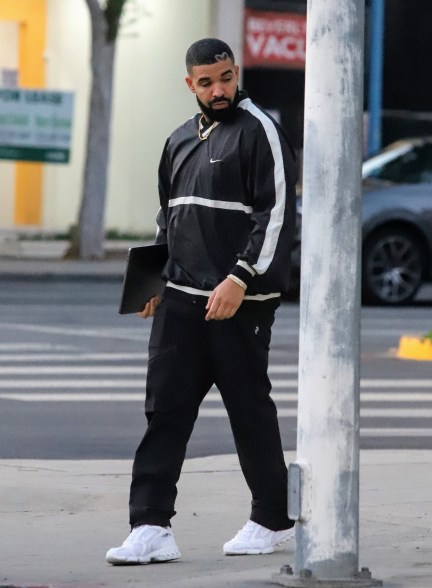 Drake leaves his office after a meeting.