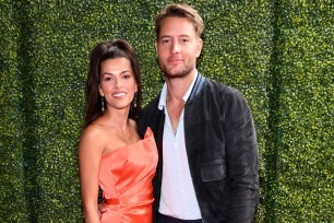 Sofia Pernas and Justin Hartley pose on a red carpet in May 2021.