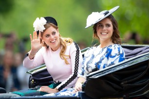 Princess Beatrice and Princess Eugenie riding a carriage in June 2019.