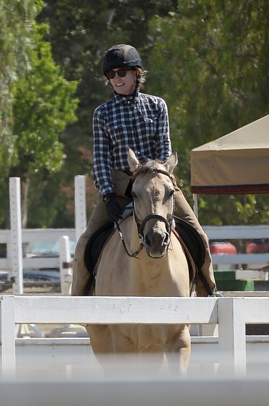 Felicity Huffman riding a horse