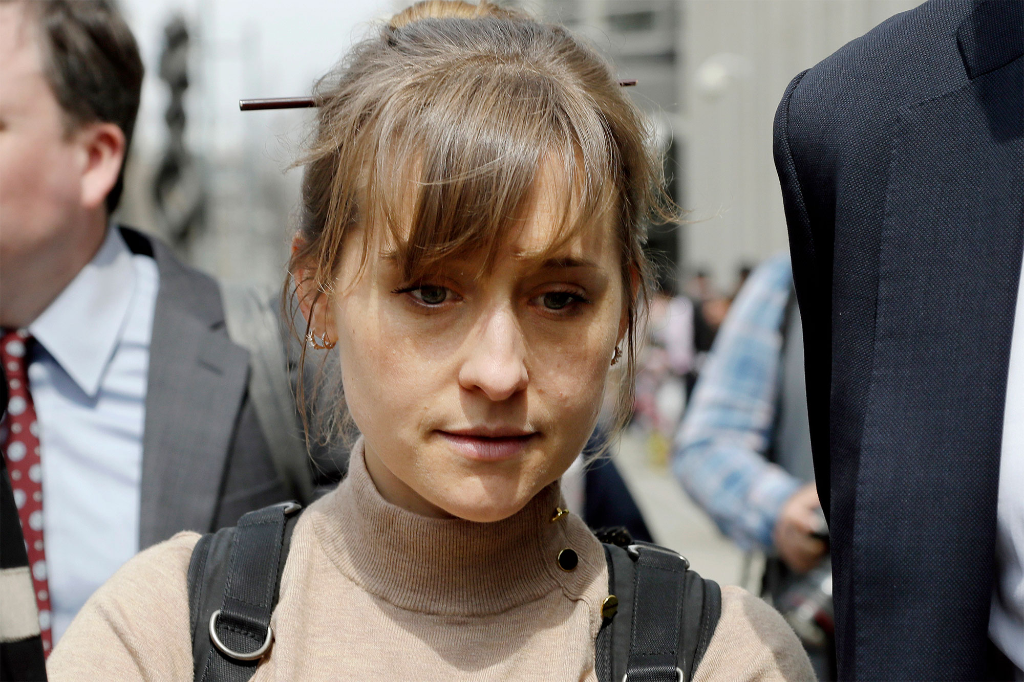 Allison Mack leaves Brooklyn federal court in New York after pleading guilty to racketeering charges in 2019.