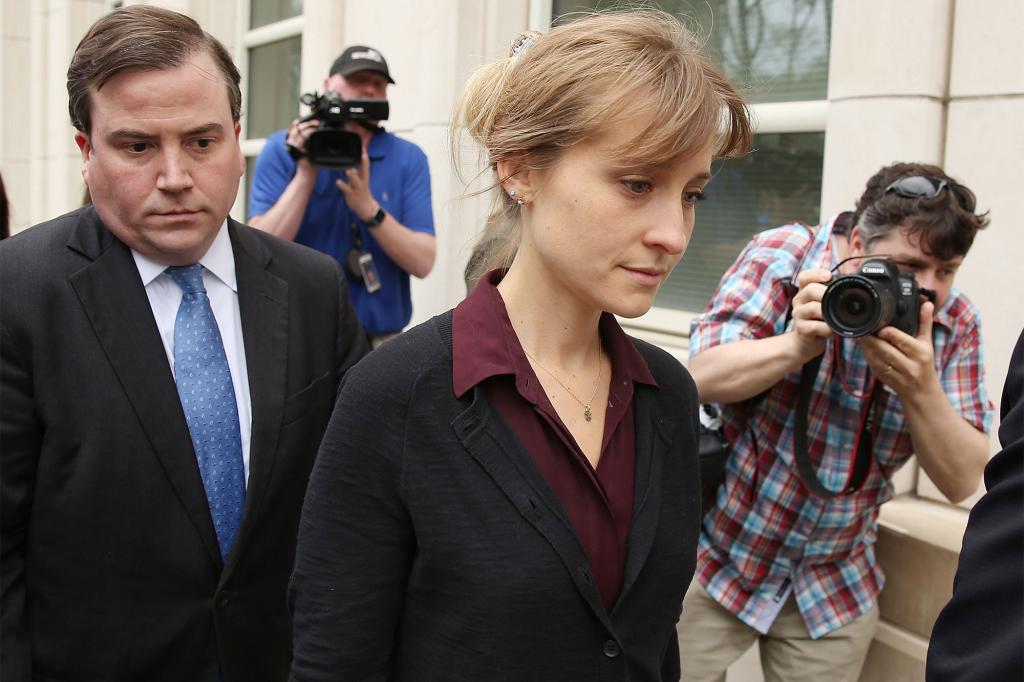 Actress Allison Mack (C) departs the United States Eastern District Court after a bail hearing in relation to the sex trafficking charges filed against her on May 4, 2018.