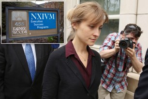 Actress Allison Mack (C) departs the United States Eastern District Court after a bail hearing in relation to the sex trafficking charges filed against her on May 4, 2018 in the Brooklyn borough of New York City.