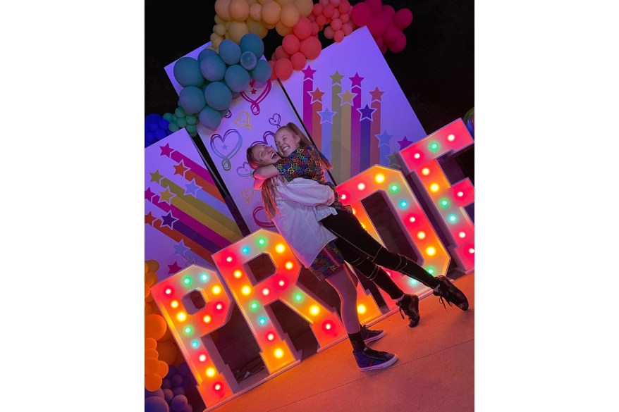 LOUD AND PROUD: JoJo Siwa (right) and her girlfriend Kylie Prew, hug while at a Pride party on their five-month anniversary.