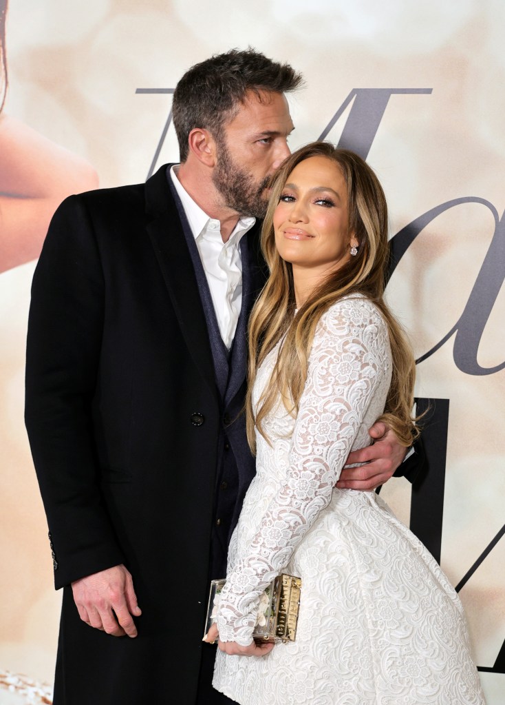 Ben Affleck and Jennifer Lopez on a red carpet. 