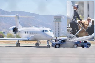 Harvey Weinstein de-boards a private jet in Los Angeles.