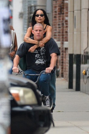 Zoe Kravitz puts her arms around Channing Tatum as they go for a bike ride.