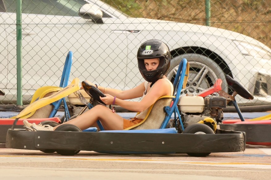 WIZ-ING BY: Emma Watson goes full throttle during a go-karting excursion in Ibiza.