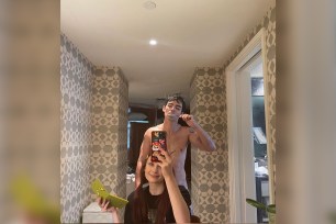 Joe Jonas poses nude behind Sophie Turner.