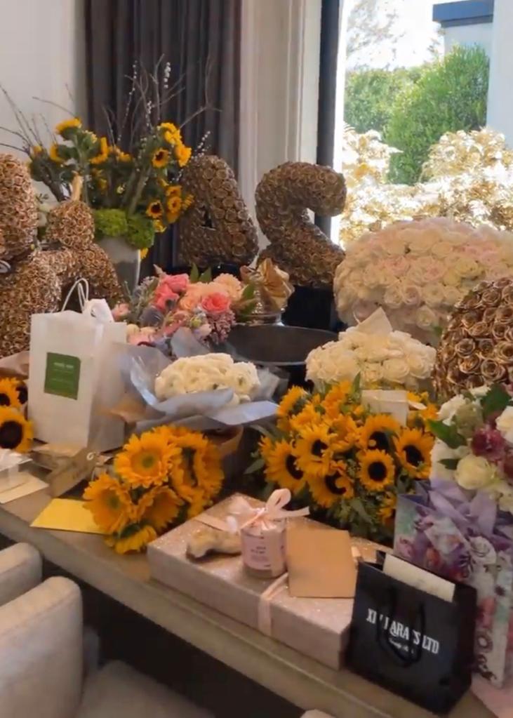 Kylie Jenner's table covered in flower bouquets.