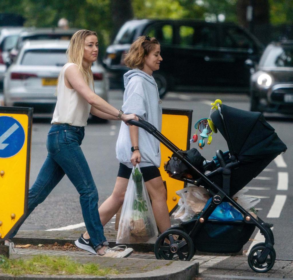 Amber Heard snapped taking her daughter for a walk in North London.