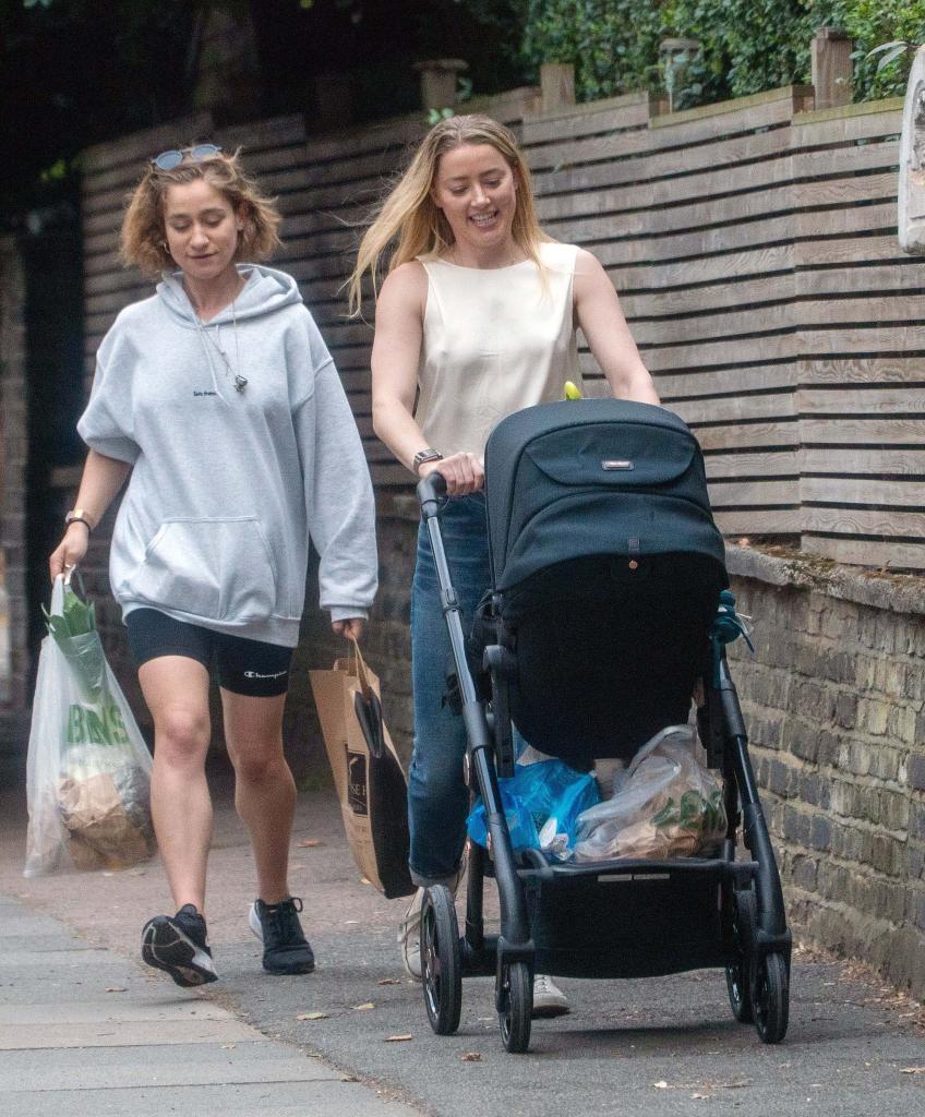 Amber Heard snapped taking her daughter for a walk in North London.