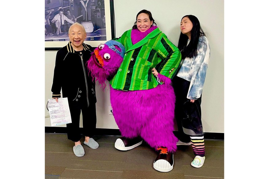 FURRY FRIEND: Awkwafina (far right) poses with puppeteer Kathleen Kim (center) and “Nora From Queens” co-star Lori Tan Chinn.