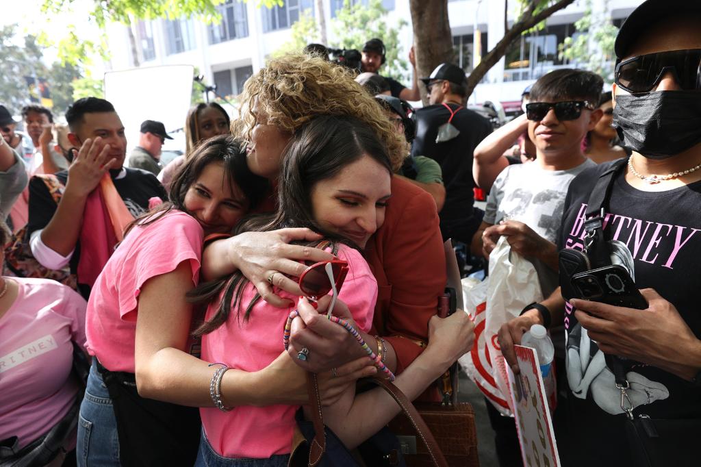 #FreeBritney activists react after news that Britney Spears' father, Jamie Spears, was removed by a judge as conservator of her estate at the Stanley Mosk Courthouse on September 29, 2021 in Los Angeles, California. Spears was placed in a conservatorship managed by her father, Jamie Spears, and an attorney, which controls her assets and business dealings, following her involuntary hospitalization for mental care in 2008. Spears and her father have asked the court to remove him from his role in the conservatorship.