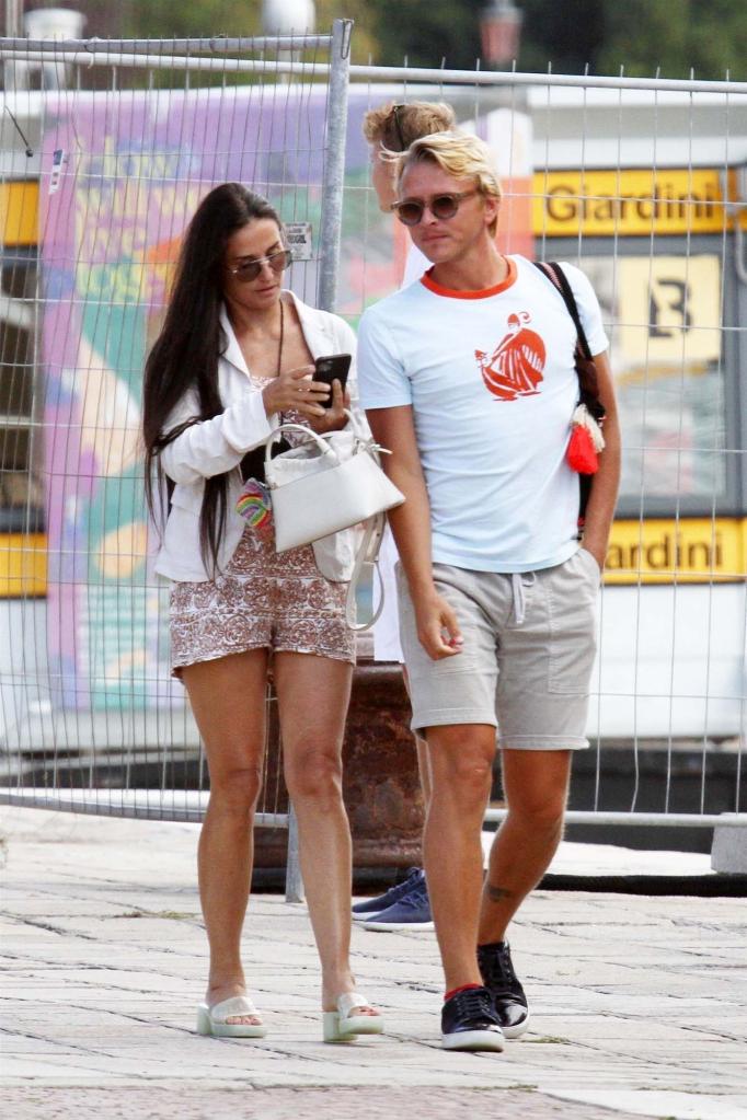 Demi Moore strolls in Venice, Italy, with a friend.