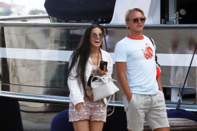 Demi Moore laughs it up with a mystery man in Venice, Italy.