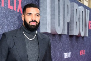 Drake stands on the red carpet at the "Top Boy" premiere.