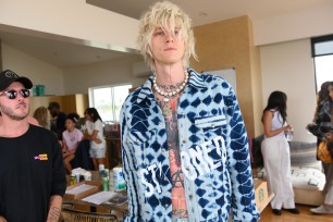 A report filed by an unnamed parking attendant claims that singer Machine Gun Kelly pushed him on the set of the movie Kelly is directing.