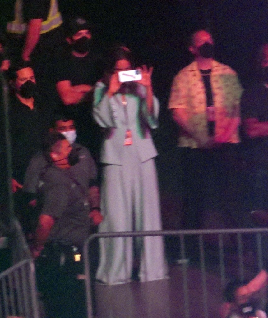 Olivia Wilde takes photos of Harry Styles performing in Las Vegas from the crowd.