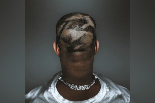 Kanye West with his new patchy haircut