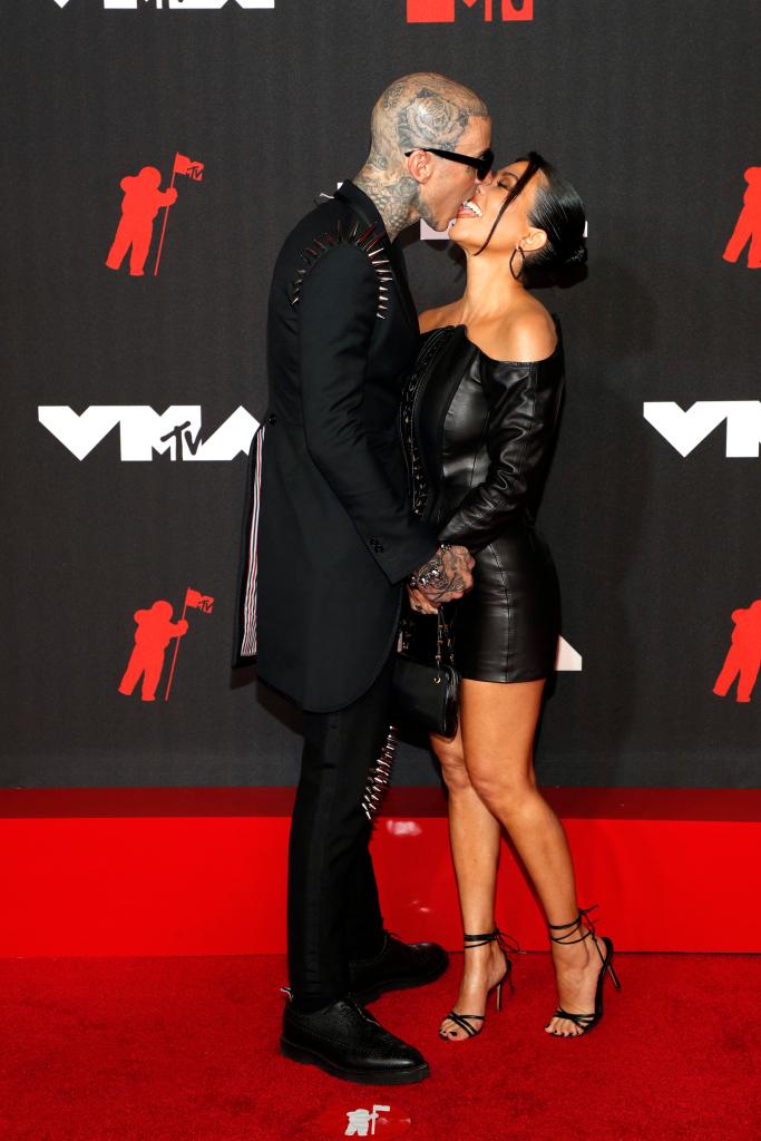 Travis Barker and Kourtney Kardashian kissing at the VMAs.