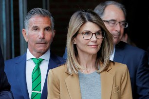 Lori Loughlin and her husband, Mossimo Giannulli, leave court in Boston in April 2019.