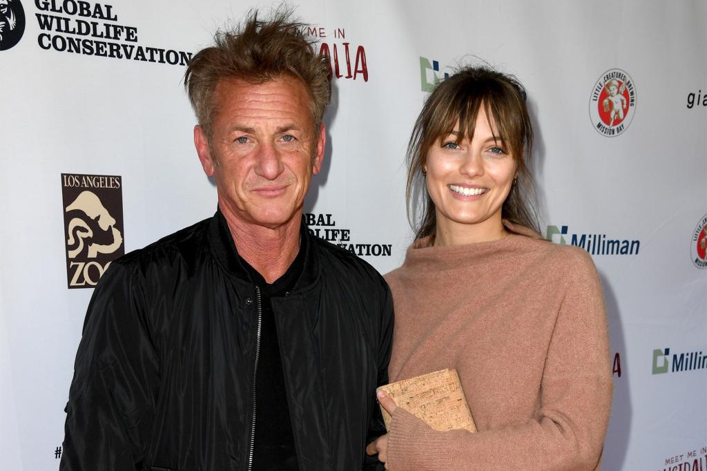 Sean Penn and Leila George posing together at the "Meet Me In Australia" event in March 2020