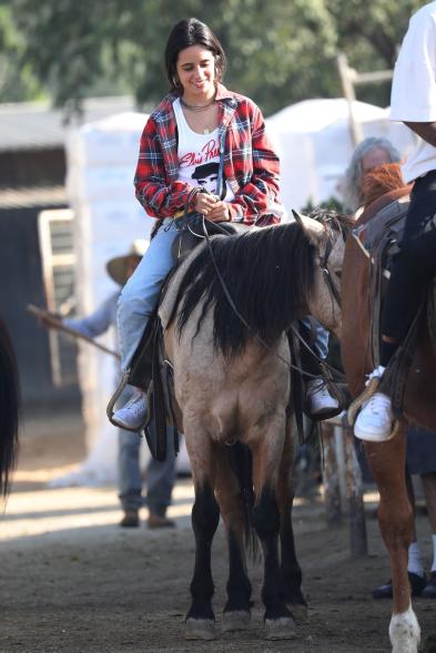 Camila Cabello on top of a horse.