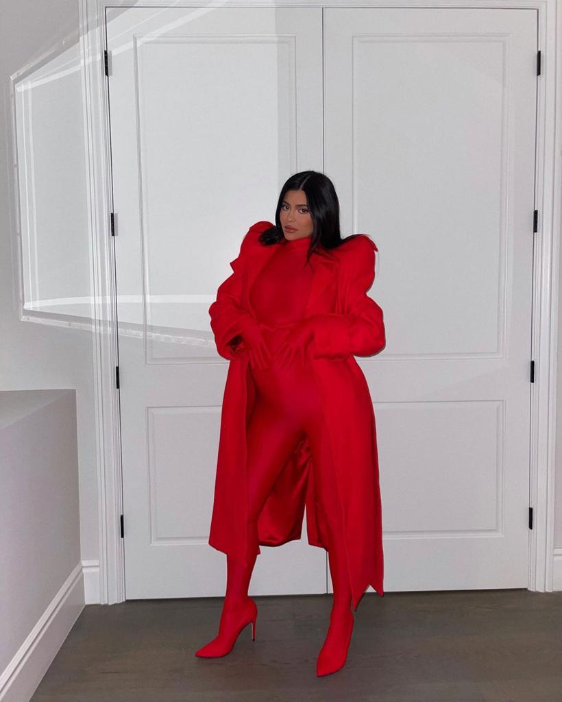 Pregnant Kylie Jenner in a red outfit.