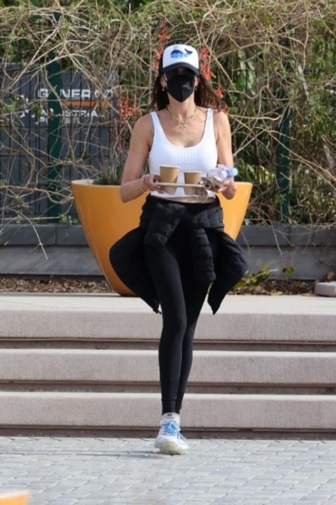 lauren silverman carrying coffee in malibu