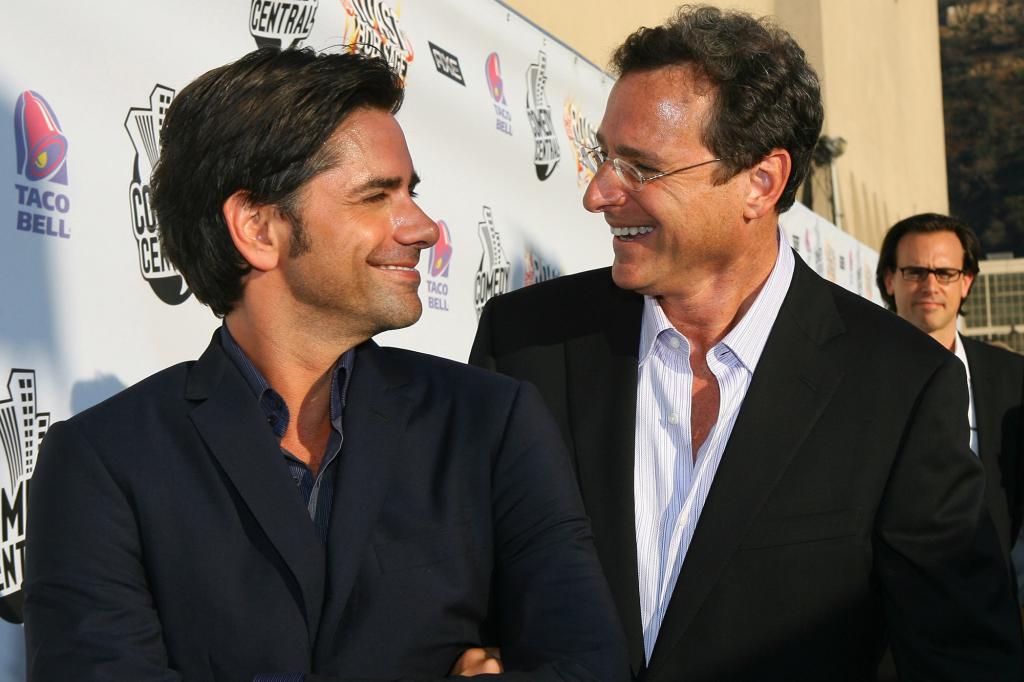 John Stamos and Bob Saget on a red carpet