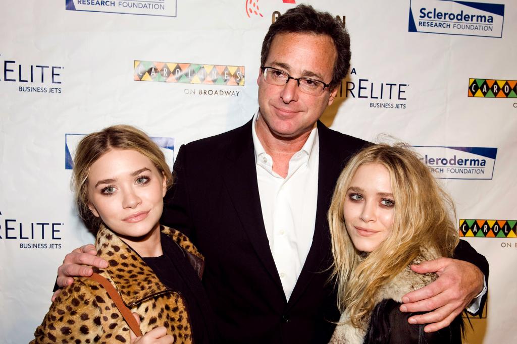 Mary-Kate and Ashley Olsen and Bob Saget on a red carpet in 2009